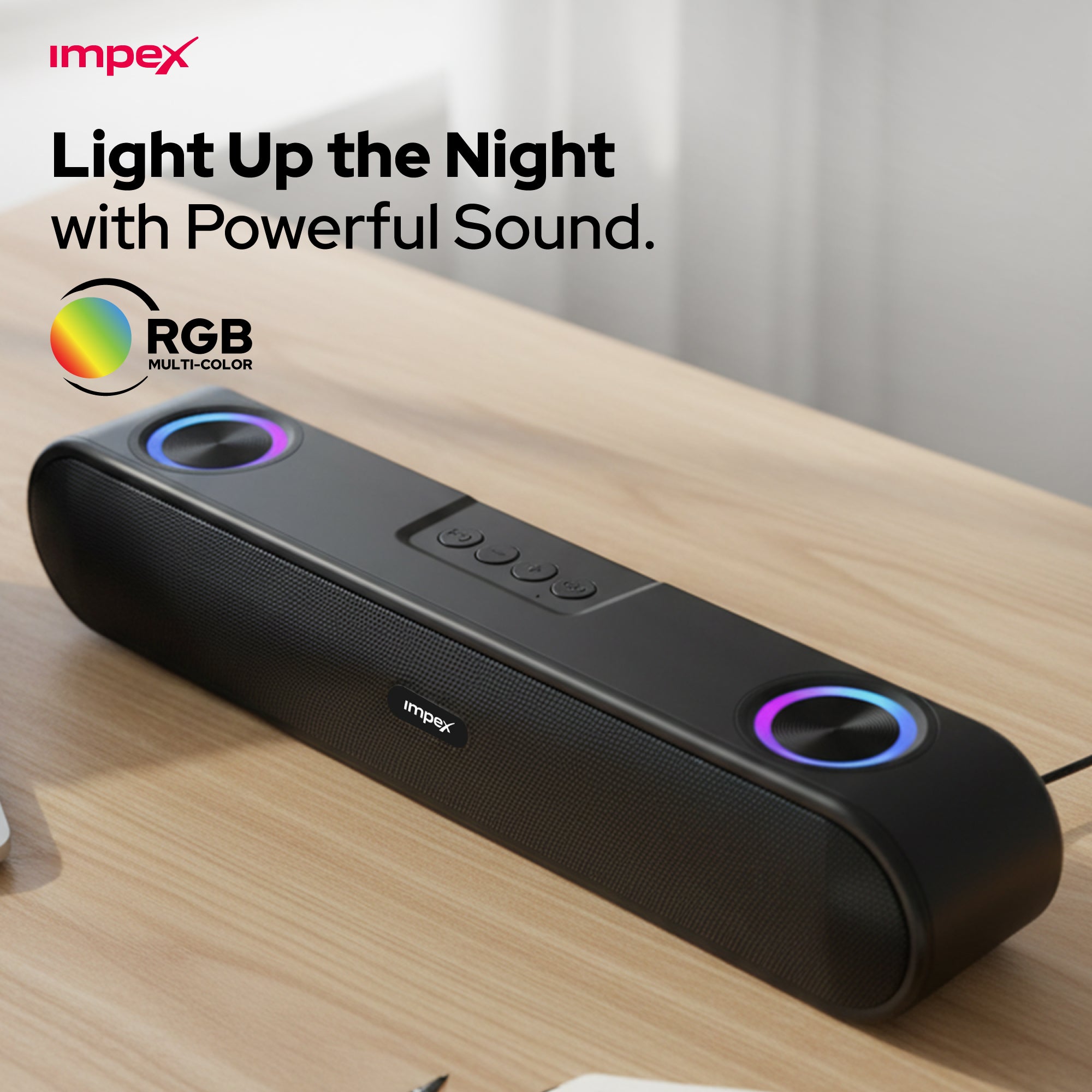 Black soundbar with RGB lighting on a wooden surface, featuring Impex branding.