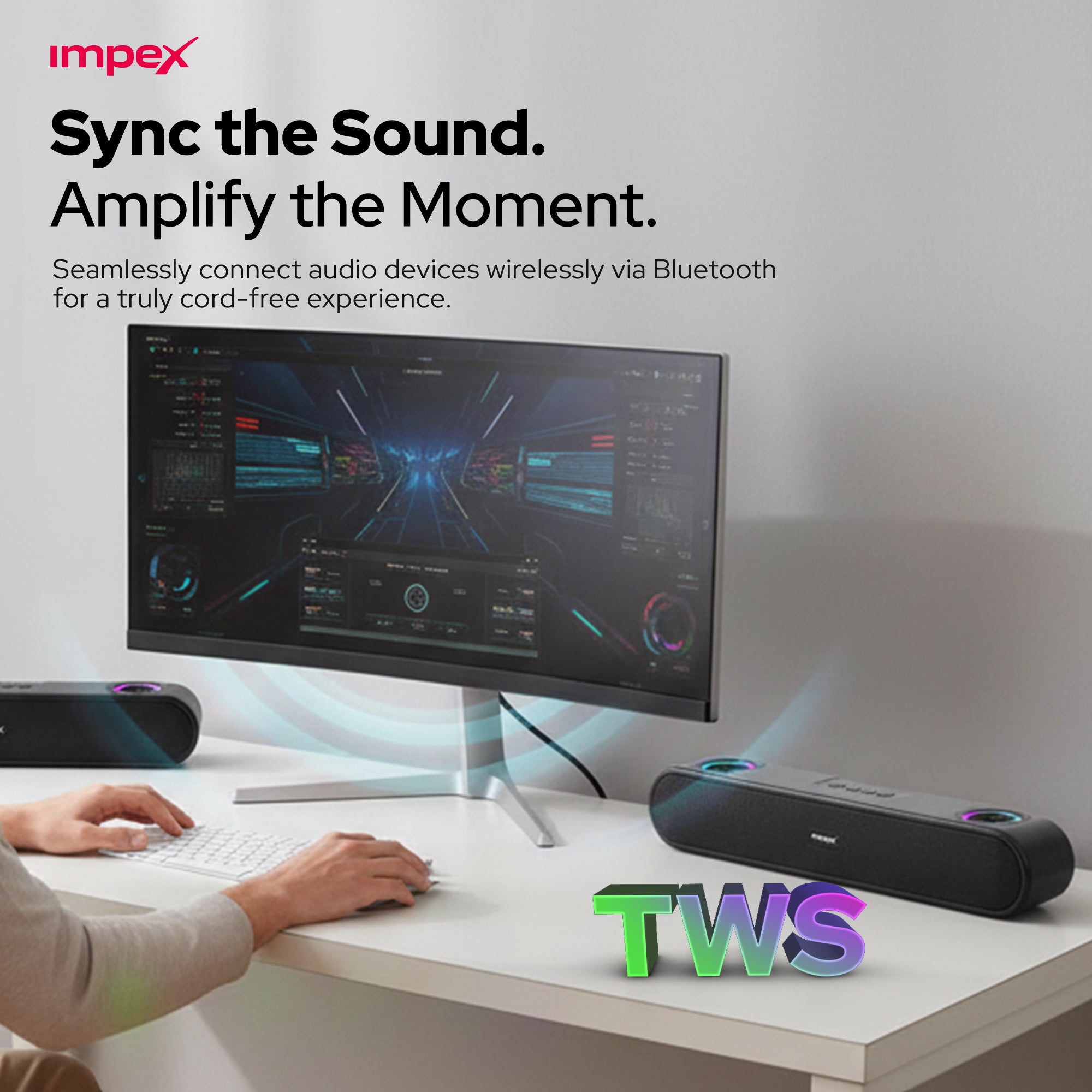 Computer setup with Bluetooth speaker and text 'Sync the Sound. Amplify the Moment.' by impex.