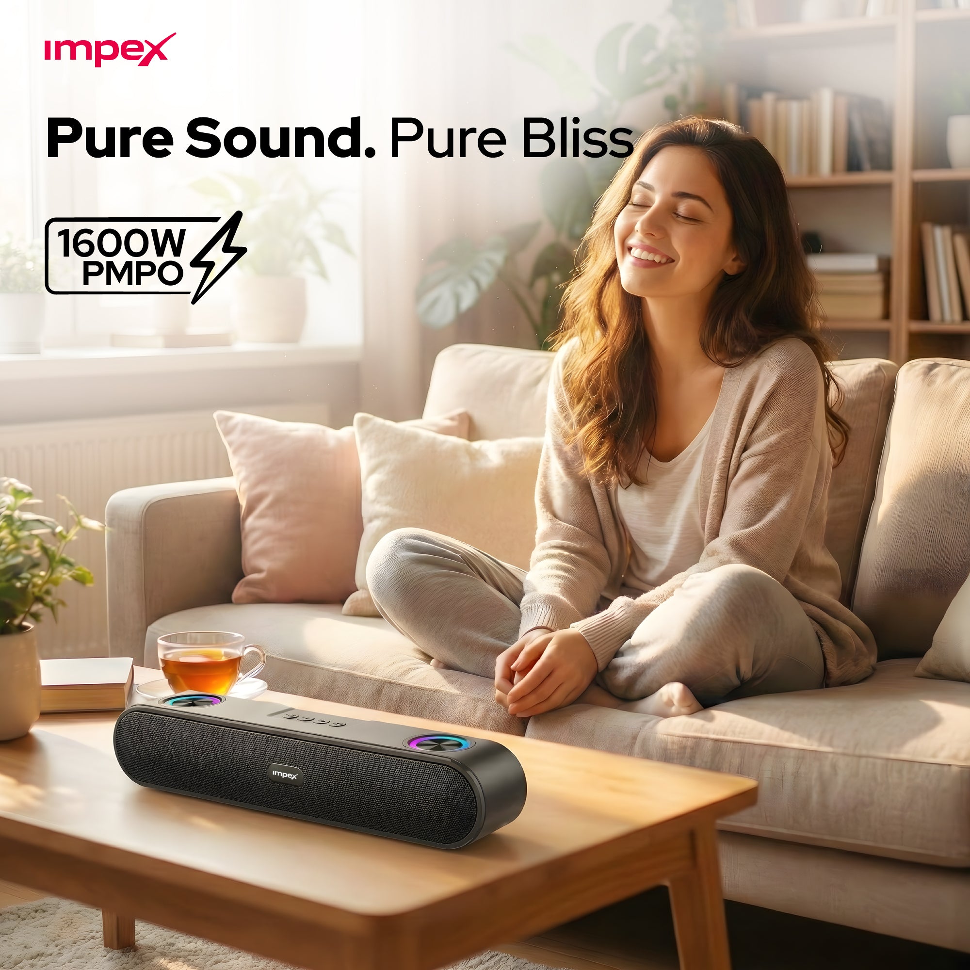 Woman sitting on a couch with a portable speaker in front of her, featuring Impex branding.
